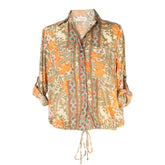 camisa  con botones de mangas largas con cuello clásico y cintura ajustable mujer arena formentera