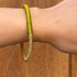 Pulsera Dunia, tejida a mano en Marruecos con hilo de oro s’fifa y seda de cactus. Diseño artesanal inspirado en la tradición de los caftanes nupciales, ligera, resistente al agua y perfecta para combinar entre sí. Una joya versátil que brilla con un toque sutil y elegante, pensada para acompañarte en cada momento.